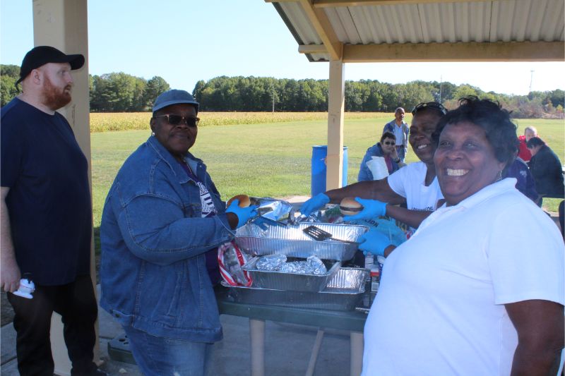 Group Smiling and Posing at a Cookout with Somerset Community Services
